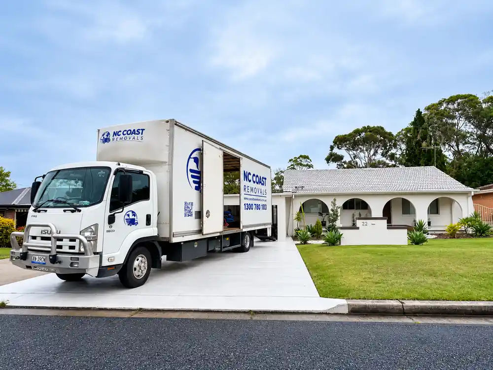 NC Coast Removals truck outside a residential property